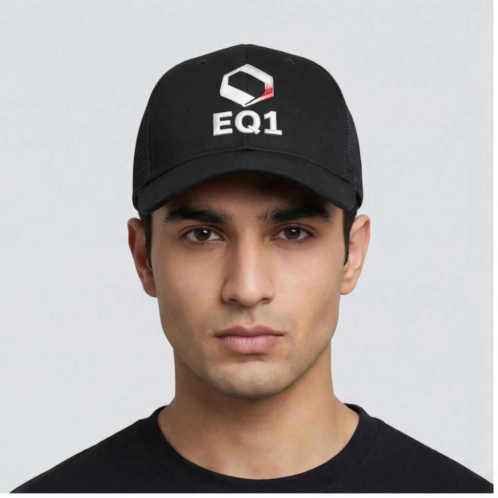 Model wearing black EQ1 trucker cap