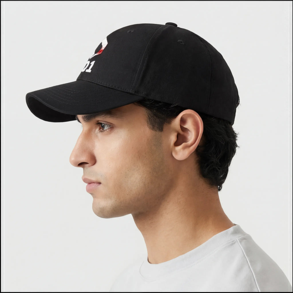 Side profile of man wearing black EQ1 baseball cap with curved brim