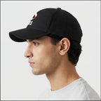 Side profile of man wearing black EQ1 baseball cap with curved brim