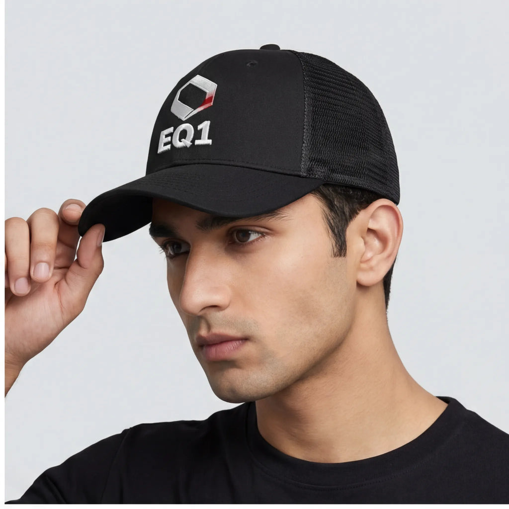 Model wearing black EQ1 trucker cap