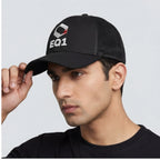 Model wearing black EQ1 trucker cap