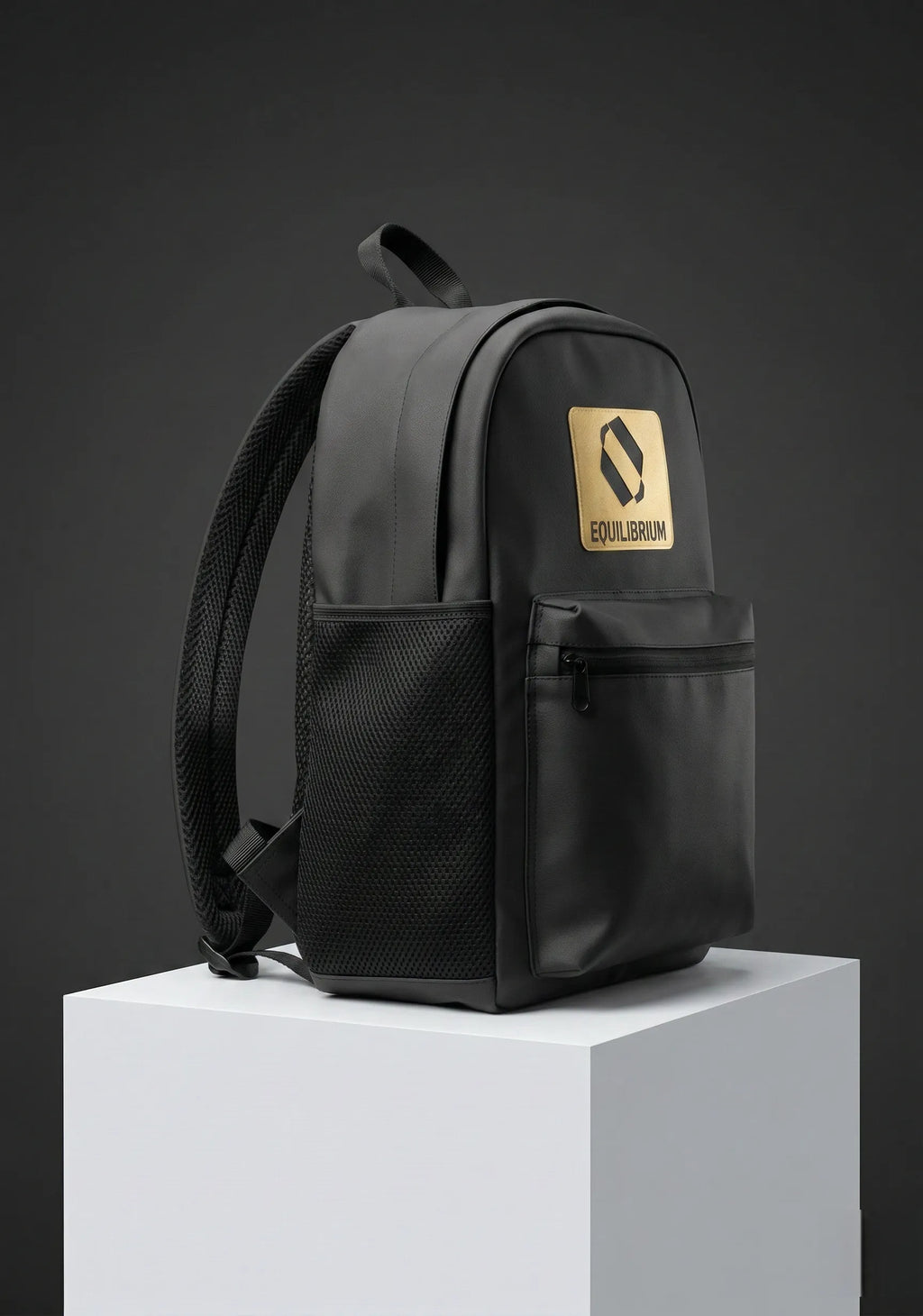 Side angle view of black backpack with gold accents