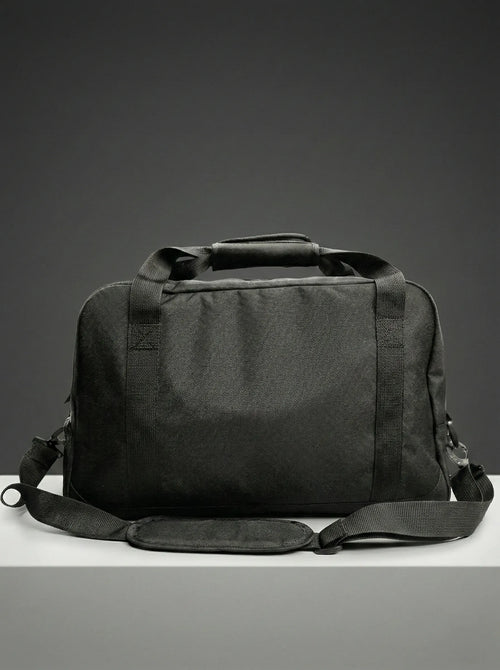 Side view of black duffel bag with sturdy handles and structure