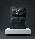 Black EQ1 backpack with dual front pockets and minimalist utility design