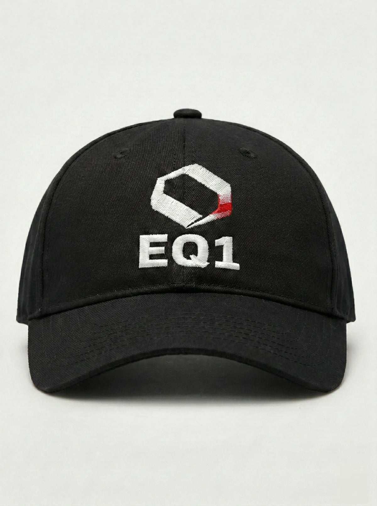 Black canvas baseball cap with minimal design and EQ1 branding
