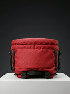 Bottom view of red backpack with straps