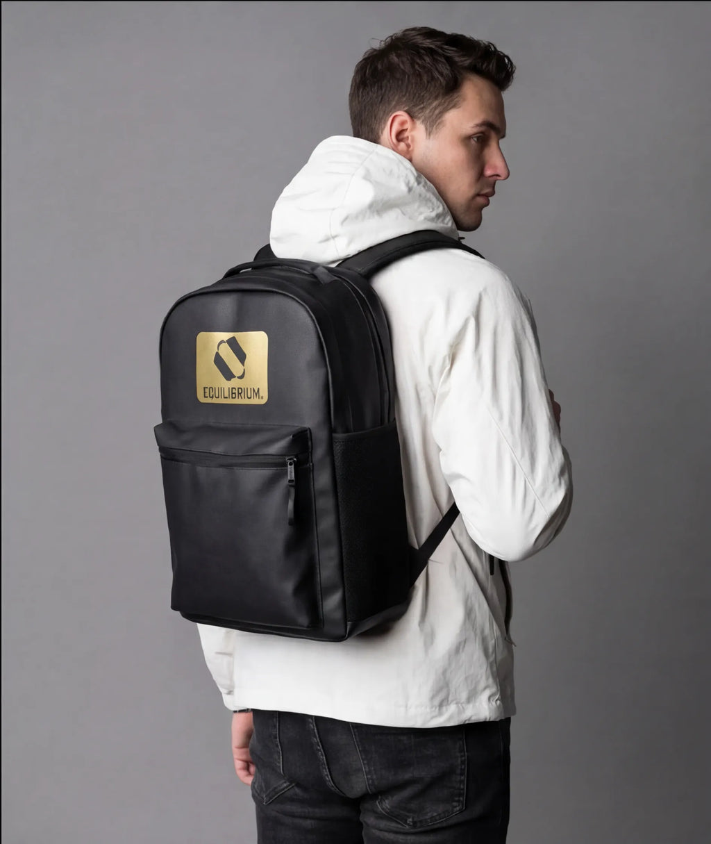 Close-up of gold detailing on black backpack
