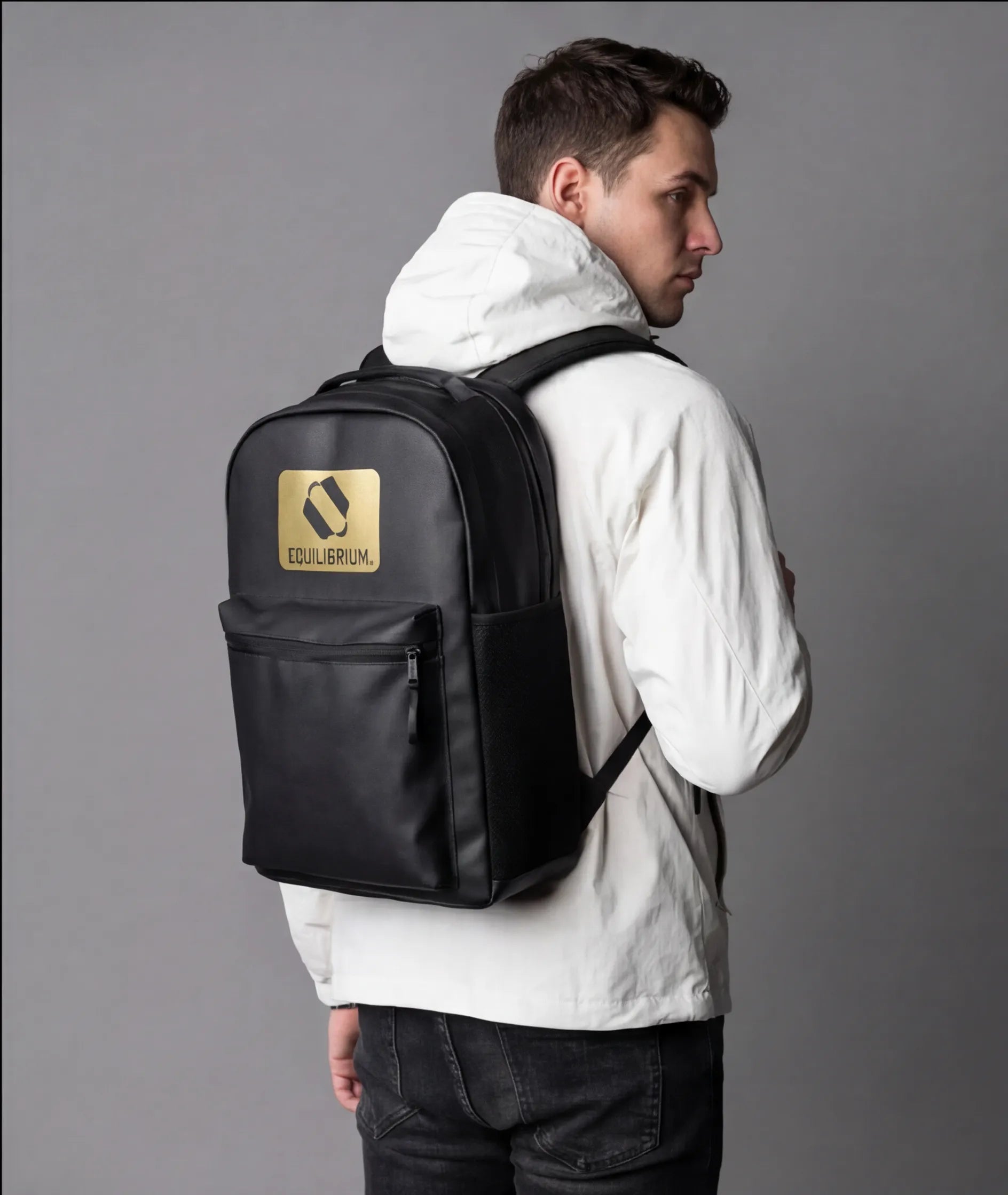 Close-up of gold detailing on black backpack