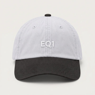 Two tone dad cap with a white crown and a black peak, EQ1 embroidery on the front