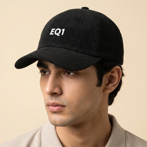 Male model wearing the black corduroy baseball cap with the EQ1 mark on the front