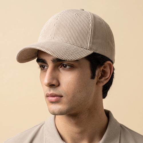 Male model wearing the plain beige corduroy baseball cap with no logo