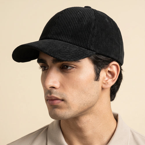 Male model wearing the plain black corduroy baseball cap with no logo