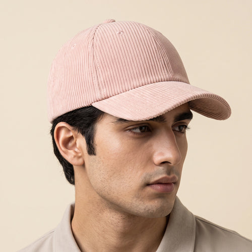 Male model wearing the plain blush pink corduroy baseball cap with no logo